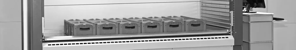 Vertical lift storage system with pick bins